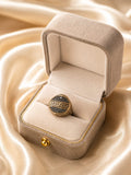 Black and dull gold ring